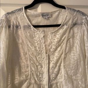 Blouse with lace accents at sleeves, button down.